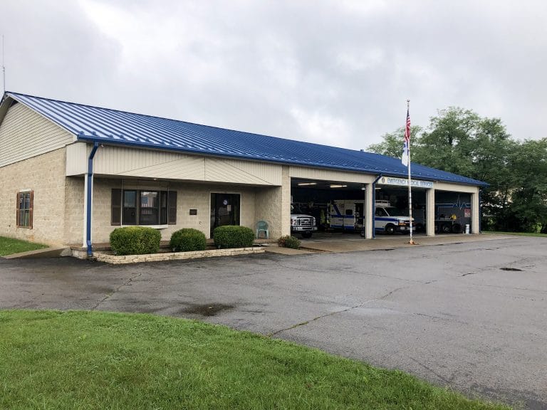 Blue standing seam metal installed on a local Emergency Service facility by Nate-O Roofing