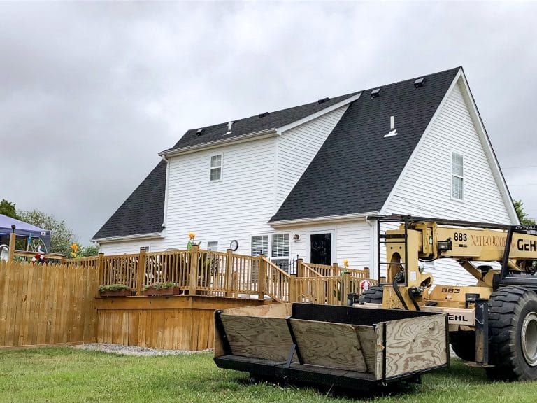 New, black shingles on a home with white siding