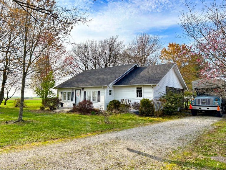 Small home with replaced shingles during a spring remodel project