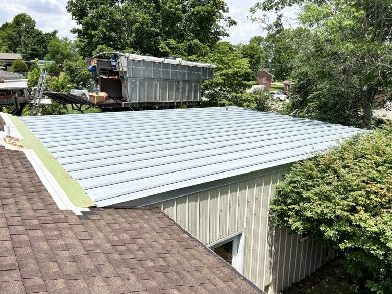Custom remodel project featuring newly installed standing seam metal on a very low slope roof with standing seam metal