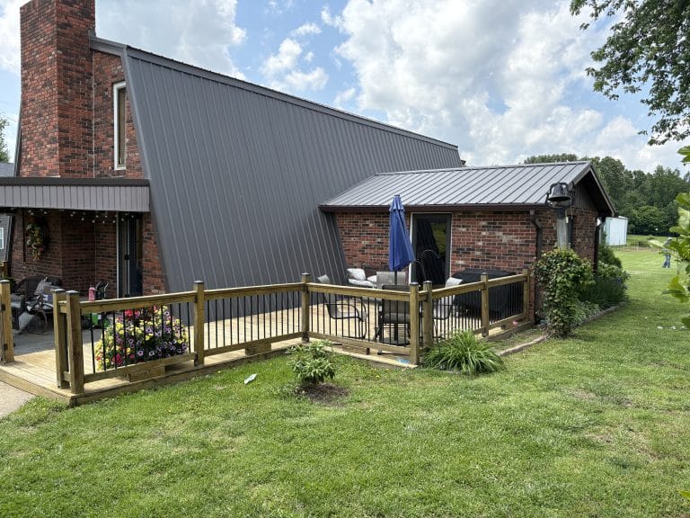 Ag panel metal roof installed on the steep roof of a unique home