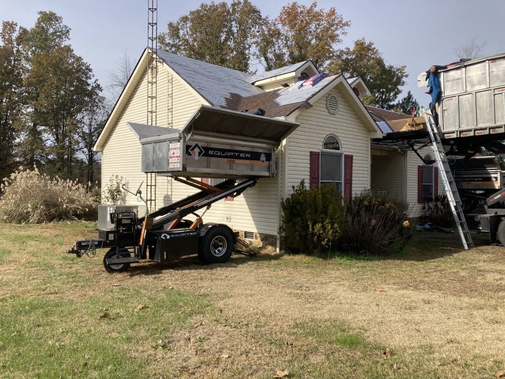 By sliding the Equipter right up to the side of the house, loose nails and shingles are safely collected for disposal.